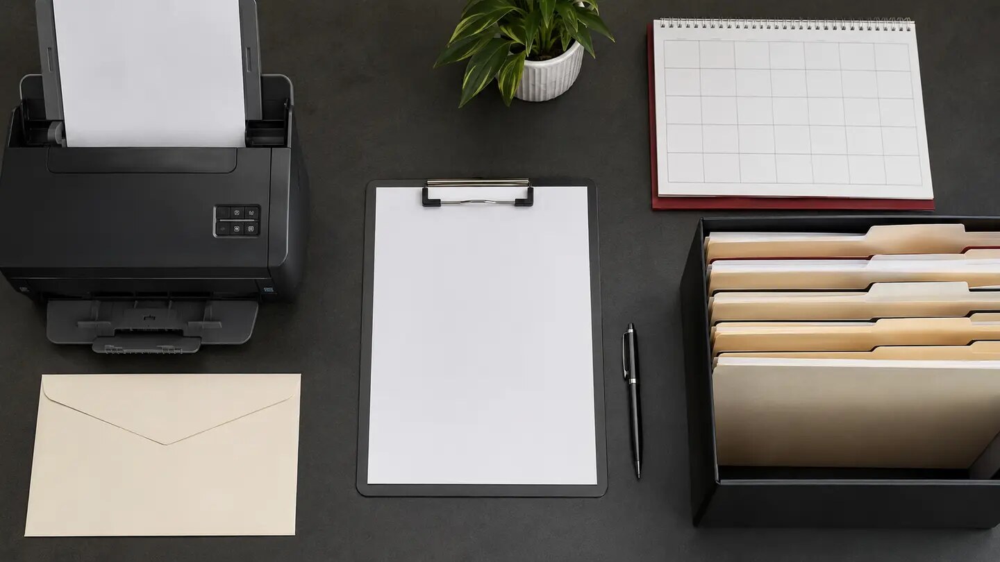 A public-records request workspace with scanner, envelope, calendar, and folders, arranged as a restrained documentary editorial scene.